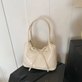 Creamy white underarm bag featuring a large 3D bow design and embossed lettering - Style 1 White