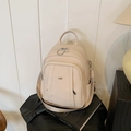 Eleganter cremeweißer Rucksack aus Leder mit Lychee-Muster und Metallring-Reißverschlüssen - Weiß