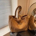 Brown fuzzy teddy plush tote bag with vintage texture and black leather pocket detail - Brown