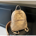 Sac à dos matelassé avec broderie nœud et poches multiples sur chaise en cuir - Khaki