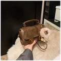 Vintage brown leather Boston bag with gold twist locks and plush doll charm accessory - With Charm / Brown