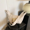 Minimalist cream white leather dumpling bag with gold buckle and wide shoulder strap - White