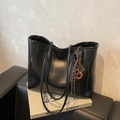 Minimalist black tote bag with vintage charm and a unique abacus pendant detail - With Charm / Black