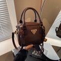 Retro dark brown square crossbody bag with vintage metal logo and top handle design - With Charm / Brown