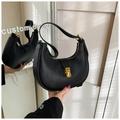 Retro black pebbled leather hobo shoulder bag featuring a gold metal lock buckle - Black