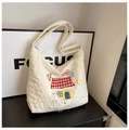 Close-up of cream quilted nylon tote with cute cartoon puppy house embroidery details - Off-white House Style (SLT-2618)