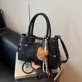 Retro black leather handbag with white stitching, silver lock and cute bear charm pendant - Black with Pendant