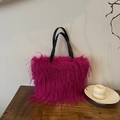 Fuchsia faux fur tote bag with black leather handles for stylish winter commuting - Rose Red