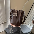 Dark brown faux leather bucket bag with silver wavy buckle and star pendant charm - With Pendant / Brown