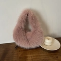 Plush light pink faux fur dumpling bag with metallic chain strap in a soft textured finish - Pink