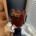 Deep brown matte leather bucket bag with gold wave buckle and star charm detail - With Pendant / Brown