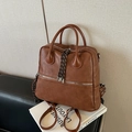 Zaino e borsa vintage marrone in ecopelle con tiri di cerniera intrecciati in bianco e nero - Marrone Senza Ciondolo