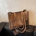 Brown leather tote bag featuring a glossy two-tone texture and a gold spherical charm - Khaki
