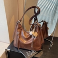 Brown faux leather tote bag with baseball keychain and front zipper detail in caramel color - Brown with Pendant