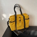 Vielseitige ingwergelbe Nylontasche mit Kordelzugtaschen und schwarzen Trageriemen - Gelb