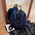 Dark blue denim backpack with dual handles and metal zipper in mirror reflection view - Dark Blue