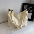Minimalistische beige Segeltuch-Beuteltasche mit verstellbarem Gurt und Reißverschluss - Gebrochenes Weiß