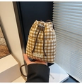 Detail of checkered woolen bucket bag with drawstring closure and sparkling rhinestones - Brown