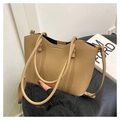 Close-up of khaki pebbled leather tote bag featuring a stylish V-cut wavy edge design - Khaki
