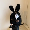 Mini black backpack with rabbit ears and a cute white fuzzy charm accessory - With Charm / Black
