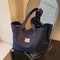 Donkerblauwe denim shopper met wit Hbag-label en grote capaciteit voor dagelijks woon-werk - Blauw