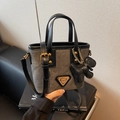 Retro grey canvas bucket bag with black leather trim and golden bear charm pendant - Blackish Green With Pendant