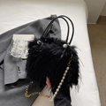 Chic black faux fur bucket bag with pearl accent and gold chain strap for women - Black
