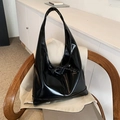Glossy black hobo bag with bow tie decoration and polished leather finish - Black