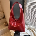 Glossy deep red hobo bag with bow detail and polished patent leather finish - Red