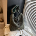 Dark green fuzzy hobo tote bag with drawstring closure and plaid lining on white blazer - Green