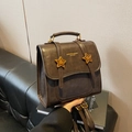 Vintage dark brown leather backpack with gold star accents and fashion lettering - Brown