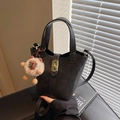 Versatile black bucket bag in matte leather finish with plush bear charm and gold buckle - Black (With Pendant)