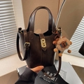 Dark brown leather bucket bag with gold hardware and plush sheep charm detail - Coffee (With Charm)