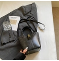 Elegant black leather bucket bag with gold hardware and adjustable shoulder strap - Black (Without Charm)