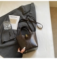 Dark brown faux leather bucket bag with gold hardware and adjustable crossbody strap - Coffee (No Pendant)