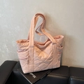 Quilted light pink tote bag with diamond stitching and side zipper pocket detail - Pink