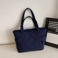 Dark blue quilted tote bag with large diamond stitching and side zipper pockets - Navy Blue