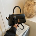 Elegant vintage black glossy square handbag with a retro bronze clasp and top handle - Black