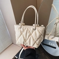 Quilted off-white bucket bag with plush diamond texture and adjustable strap - Off White
