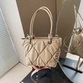 Quilted beige puffer bucket bag with soft diamond lattice pattern and silver hardware - Khaki