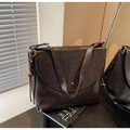 Close-up of matte dark brown leather texture and metal tassel detail on retro tote bag - Dark Coffee With Pendant