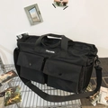 Grande borsa tote nera in tela con tasche multiple e tracolla regolabile - Nero