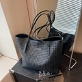 Woven black leather tote bag with dual shoulder straps and spacious minimalist design - Black