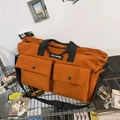 Grande borsa tote in tela arancione con tasche frontali e tracolla nera regolabile e solida - Arancione