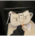 Chic off-white crescent underarm bag in textured PU leather with metal buckle accent - White