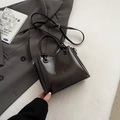 Borsa a secchiello in pelle cerata marrone scuro lucida con manici annodati e tracolla - Caffè senza Ciondolo