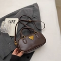 Dark brown leather Boston bag with gold triangle hardware and adjustable strap - Style Without Charm / Coffee