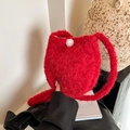 Red plush cat-shaped bucket bag with soft faux fur and decorative white pompom - Red