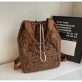 Macro detail of leopard print tote bag fabric with drawstring and nylon handle - Brown