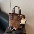 Brown leather bucket bag with gold studs and plush pendant, stylish crossbody purse - Coffee with Pendant
